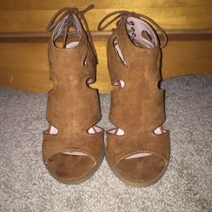 Brown heeled sandals.